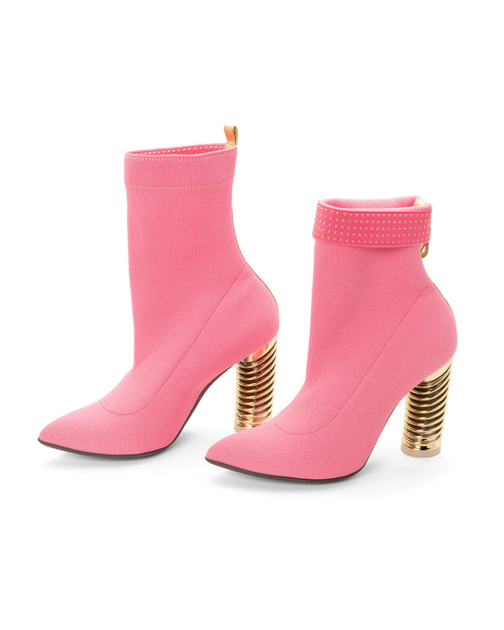 Fold Over Knit Boots Bubblegum made from Recycled Water Bottles on a Gold Swirl Cone